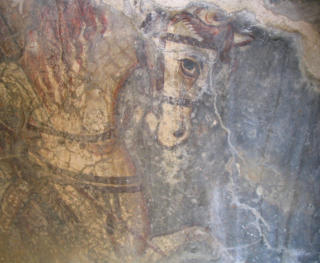 Muurschildering met een paard in Agios Lucas.